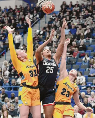  ?? ?? UConn forward Ice Brady (25) plays in No. 15 UConn’s 95-64 win over No. 18 Marquette at the XL Center in Hartford on Dec. 31.