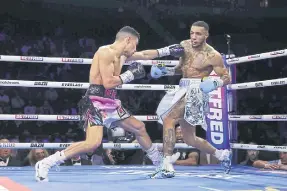  ?? ?? Jordan Gill (left) punches Zelfa Barrett. All photos Getty Images.