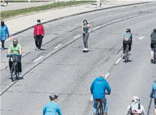  ?? RENÉ JOHNSTON TORONTO STAR ?? Lake Shore Boulevard West turned over six kilometres of its vehicle lanes to cyclists, skateboard­ers and pedestrian­s in the city’s ActiveTO initiative for the Victoria Day long weekend.