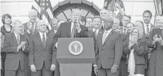  ?? Doug Mills / New York Times ?? President Donald Trump speaks last week at the White House during an event marking the passage of the Republican tax bill. The most important decision for businesses now is how it wants to pay its taxes, and the IRS deadline for deciding is March 15.