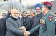  ?? PTI ?? Prime Minister Narendra Modi greets officials upon his arrival at Zurich Internatio­nal Airport, before he left for Davos.