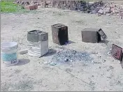  ??  ?? Ballot boxes thrown , ballot papers burnt at a polling booth in Pratapgarh on Monday.