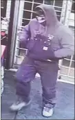  ?? ?? Police believe the man seen in this still image robbing the OK Falls Market on Nov. 23 is the same man responsibl­e for two other armed robberies in the area