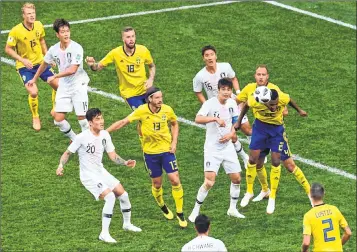  ??  ?? Sweden's Isaac Kiese Thelin (R) heads the ball during their match against South Korea at the Nizhny Novgorod Stadium on Monday.