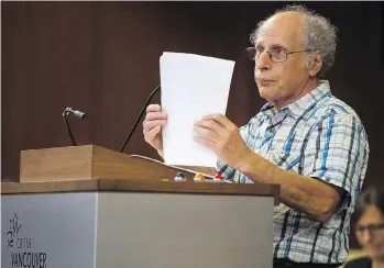  ?? GERRY KAHRMANN ?? Mel Lehan picks up his notes after speaking before Vancouver City Council on proposed changes to zoning to allow duplexes in the vast majority of the city’s low-density, single-family areas.