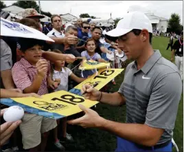  ?? Chris Carlson ?? The Associated Press Rory Mcilroy, signing autographs after practice for the PGA Championsh­ip, has a history of strong play at the Quail Hollow course in Charlotte, N.C.