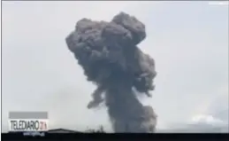  ?? TVGE VIA AP ?? This TVGE image made from video shows smoke rising over the blast site at a military barracks in Bata, Equatorial Guinea, on Sunday.