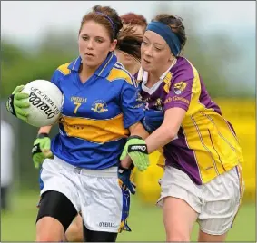  ??  ?? Kellie Kearney in action on one of her first really big days in a Wexford jersey, tackling Tipperary’s Shauna Ryan in the 2010 All-Ireland Minor ‘B’ final in Freshford.