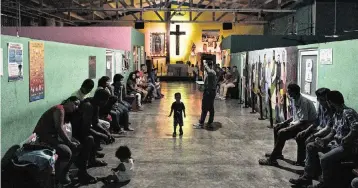  ?? LUIS ANTONIO ROJAS NYT ?? Migrants at the Amparito shelter in Villahermo­sa, Tamaulipas, Mexico, listen to guidelines from a staff member in late April. In response to pressure from the Biden administra­tion to curb migration flows, Mexico has quietly bused thousands of migrants away from the U.S. border to sites deep in the country’s south.