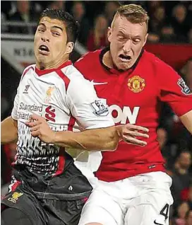  ??  ?? Back in the fray: Liverpool’s Luis Suarez (left) returned from suspension in the 1-0 defeat to Manchester United in the League Cup on Wednesday. — AP