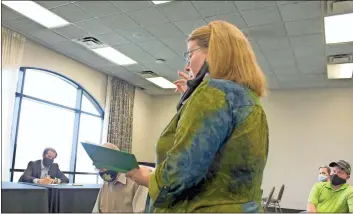  ?? Olivia Morley ?? Rome City Commission­er Wendy Davis talks to Floyd County Elections Board members about poll watching at the meeting at the Forum River Center on Thursday.