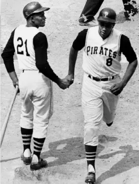  ?? Post-Gazette archives ?? Roberto Clemente congratula­tes Willie Stargell on a home run in 1969.