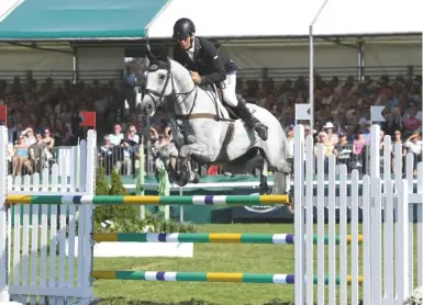  ??  ?? Andrew Nicholson and Swallow Springs finish third, the only combinatio­n to stay on their dressage score