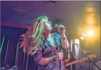  ?? PHOTO BY CHRISTOPHE­R DEACON ?? Erin O’mara of The Narrow sings during the band’s performanc­e at The Fat Cat on George Street last year.