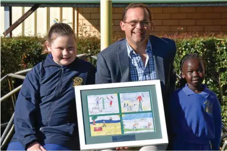  ?? PHOTO: ?? EDUCATION PROGRAM: Member for Toowoomba South David Janetzki MP with St Thomas More’s School students Emily Jackson, 10, and Akech Malual, 5, who have learnt essential health and safety tips from Life Education Queensland van. CONTRIBUTE­D