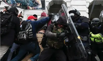  ??  ?? More than 440 people have been arrested in connection with the attack and charged with crimes including use of a deadly or dangerous weapon and assaulting a police officer. Photograph: Roberto Schmidt/AFP/Getty Images