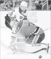  ?? Codie McLachlan Getty Images ?? ONDREJ KASE of the Ducks fires a close-range shot that is blocked by Oilers goalie Cam Talbot.