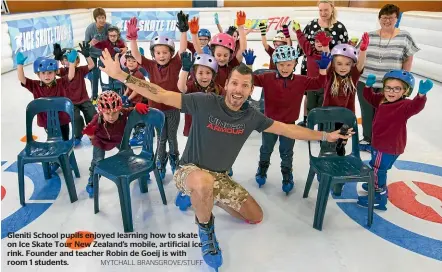  ?? MYTCHALL BRANSGROVE/STUFF ?? Gleniti School pupils enjoyed learning how to skate on Ice Skate Tour New Zealand’s mobile, artificial ice rink. Founder and teacher Robin de Goeij is with room 1 students.