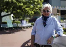  ?? ASHLEY LANDIS - THE ASSOCIATED PRESS ?? In this Friday, May 22, 2020 photo, Bob Baffert, twotime Triple Crownwinni­ng trainer, lowers his bandana during an interview while keeping his distance at Santa Anita Park in Arcadia, Calif.