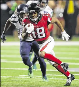  ?? CURTIS COMPTON / CCOMPTON@AJC.COM ?? Wide receiver Taylor Gabriel takes off on a 37-yard catch and run that set up a field goal in the second quarter, giving the Falcons the lead for good at 12-10.