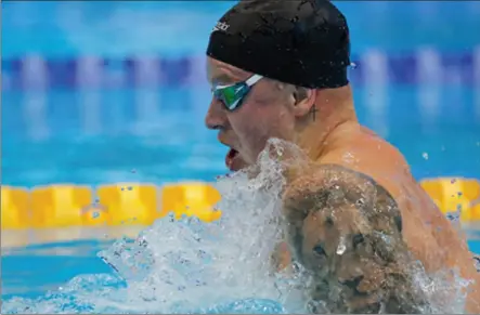  ?? ?? Adam Peaty in the 100m breaststro­ke heats at the 2024 British swimming championsh­ips and Olympic trials