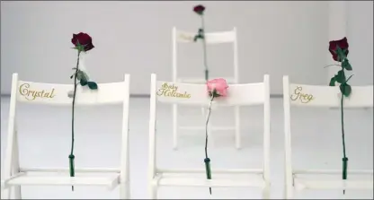  ?? The Associated Press ?? A memorial for the victims of the shooting at Sutherland Springs First Baptist Church includes 26 white chairs, each painted with a cross and and rose, is displayed in the church in Sutherland Springs, Texas on Sunday.