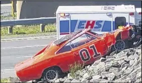  ?? PHoto courteSy of cHriS cook/facebook ?? Police were called to the crash of a car made to look like the General Lee on Highway 102 on Monday.