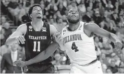  ?? AP Photo/Elise Amendola ?? Texas Tech’s Zach Smith, left, and Villanova’s Eric Paschall fight for position under the basket Sunday in Boston. ■