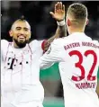  ?? DPA-BILD: GENTSCH ?? Joshua Kimmich (rechts) und Arturo Vidal feiern das Tor zum 3:0.