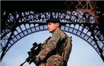  ?? - Reuters/Christian Hartmann/File photo ?? ON GUARD: A French soldier stands guard under the Eiffel Tower, as France officially ended a state of emergency regime, replacing it with the introducti­on of a new security law, in Paris, France, November 1, 2017.