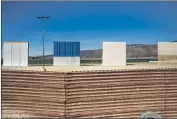  ?? Kent Nishimura Los Angeles Times ?? EIGHT border wall prototypes, each about 30 feet wide and 30 feet high, sit on U.S. land in Otay Mesa.