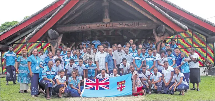  ?? Photo: Peni Komaisavai ?? Team Fiji athletes and officials with the Vanuatu Fijian community after the church service at the Chiefs Makamal in Port Vila, Vanuatu, on December 3. 2017.