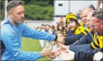  ?? FM4759182 Buy this picture from kentonline.co.uk ?? Manager Jay Saunders congratula­ted by fans for his season’s work
