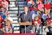  ?? AP PHOTO/JOHN BAZEMORE ?? Sen. David Perdue, R-Ga., speaks during a campaign rally for President Donald Trump at Middle Georgia Regional Airport on Friday in Macon, Ga.