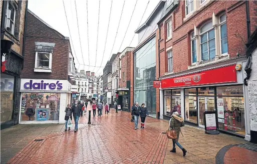  ?? PAUL ELLIS PHOTOS AFP VIA GETTY IMAGES ?? A shopping area in Wrexham, where social and economic problems have long been in the daily forecast — issues only exacerbate­d by Brexit and the pandemic.