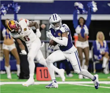  ?? Ron Jenkins/Getty Images ?? Defensive back DaRon Bland set an NFL record with his fifth intercepti­on return for a touchdown in the fourth quarter to cap the Cowboys’ victory Thursday over the Commanders.