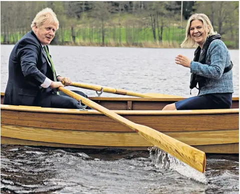 ?? ?? Boris Johnson and his Swedish counterpar­t Magdalena Andersson after signing a defence pact. Mr Johnson tweeted: ‘We are literally and metaphoric­ally in the same boat’