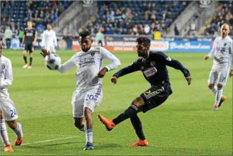  ?? MICHAEL REEVES — FOR DIGITAL FIRST MEDIA ?? Union defender Matt Real, left, puts in a cross ahead of the defense of San Jose’s Anibal Godoy Saturday night during a 1-1 draw at Talen Energy Stadium.