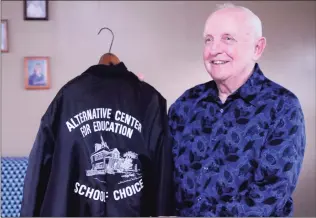  ?? Hearst Connecticu­t Media file photo ?? In 2012, Joe Pepin, of Danbury, holds his jacket from the Alternativ­e Center for Education, the Danbury school he founded and where he was the first principal and remained for 20 years. He died on Friday at 85.