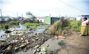  ?? Picture: Sino Majangaza ?? Raw sewage from a blocked communal toilet in an informal settlement runs through the streets of East Bank, Alexandra, in Johannesbu­rg.