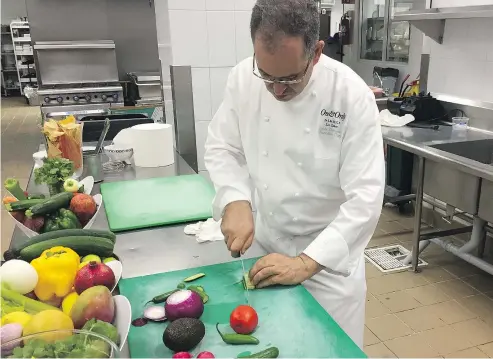  ?? ALEESHA HARRIS/PNG ?? Chef Larbi Dahrouch chops vegetables in the kitchen at Agua by Larbi at the One&amp;Only Palmilla Resort in Los Cabos, Mexico.