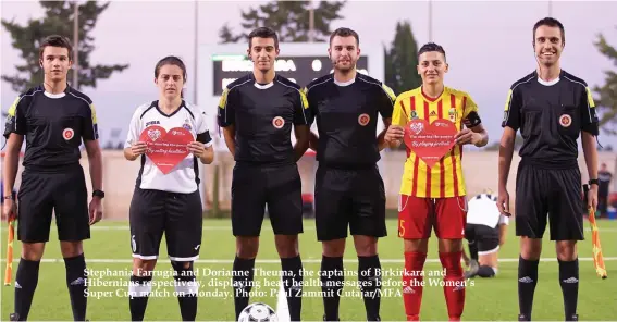  ??  ?? Stephania Farrugia and Dorianne Theuma, the captains of Birkirkara and Hibernians respective­ly, displaying heart health messages before the Women’s Super Cup match on Monday. Photo: Paul Zammit Cutajar/MFA