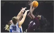  ?? (AP/Michael Caterina) ?? Mississipp­i State’s Jessika Carter (right) shoots over Creighton’s Morgan Maly (30) and Emma Ronsiek during the second half of Friday’s NCAA Women’s Tournament first-round game in South Bend, Ind. The Bulldogs won 81-66.