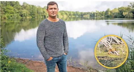  ?? FOTO: DPA ?? Eugen Janischews­ki steht am Ufer des Latumer Sees. Er hat die gelbe Anakonda entdeckt.