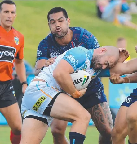  ?? Picture: PATRICK WOODS ?? Keegan Hipgrave runs the ball for the Titans against the Warriors at Sunshine Coast Stadium.