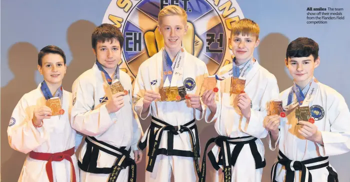  ??  ?? All smiles The team show off their medals from the Flanders Field competitio­n