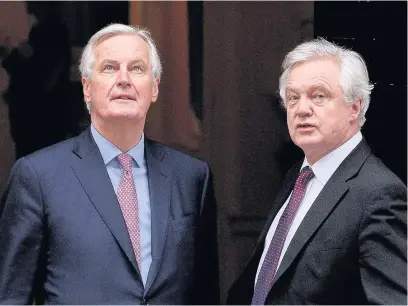  ?? Leon Neal ?? > EU chief Brexit negotiator Michel Barnier, left, and Brexit Secretary David Davis in Downing Street