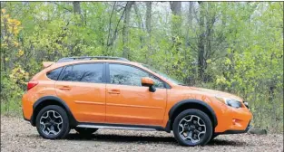  ?? PHOTOS: KEVIN MIO, THE GAZETTE ?? The 2013 Subaru XV Crosstrek has the off-road capabiliti­es and high ground clearance for a ride through the woods, but offers a sedan-like feel that makes it equally at home on city streets and highways.