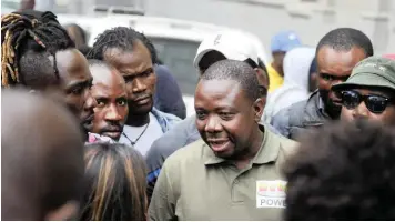  ?? | ARMAND HOUGH African News Agency (ANA) ?? REFUGEE leader Jean-Pierre Balous addresses his supporters after appearing in court.