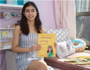  ?? ANTHONY VAZQUEZ/SUN-TIMES ?? Riya Joshi, a 15-year-old Chicago puzzle maker, created “Detective Wordy,” an original booklet of crosswords, word scrambles and word searches, this spring.